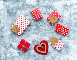 Fototapeta premium Love heart and gift boxes on vintage background, valentines day card concept .