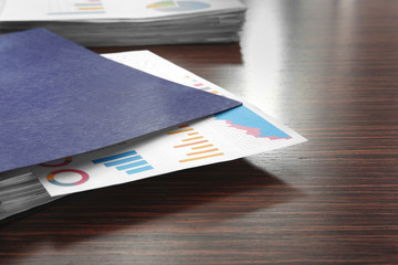 Folder with documents on table