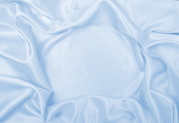 Smooth elegant blue silk or satin luxury cloth texture as abstract background. Luxurious background...