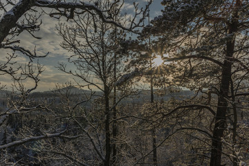 View from Semnicka rock with cloudy sun and snow in west Bohemia