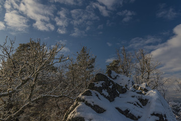 View from Semnicka rock with cloudy sun and snow in west Bohemia