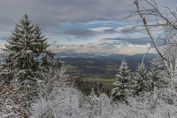 View from Semnicka rock with cloudy sun and snow in west Bohemia