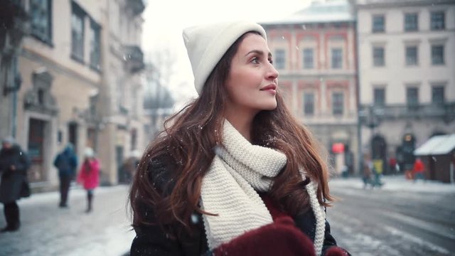 Portrait beautiful happy young woman walks around the city smiling charming christmas fun girl holiday portrait happiness young casual beauty celebration close-up attractive face snow winter