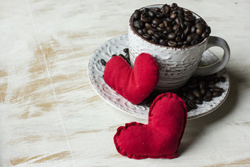 Morning Cup of coffee and heart for St. Valentines Day on white table.