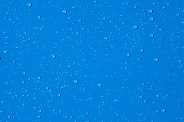 Texture of water drops on a blue background