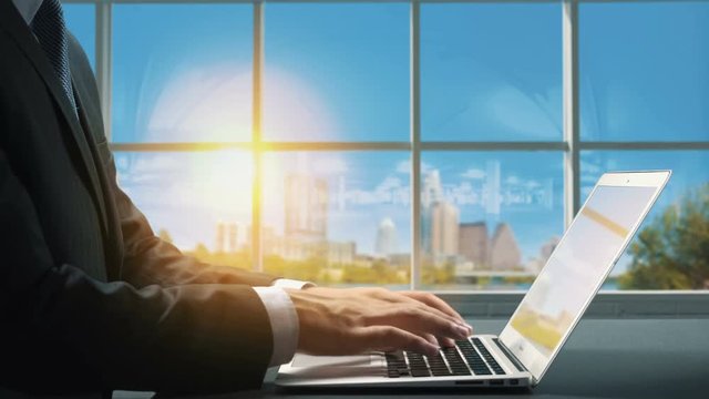 View of Austin Texas .Close up hand Businessman using laptop
