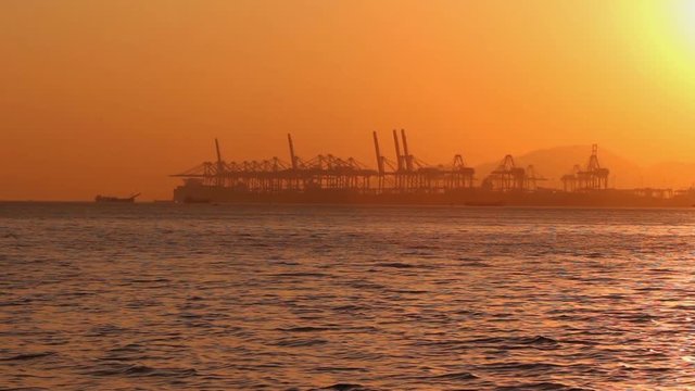Shekou - Chiwan cargo port in Shenzhen, China at sunset; Shenzhen port is one of top 5 busiest cargo ports in the world;