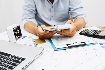 Business man analysis in cost of work project.