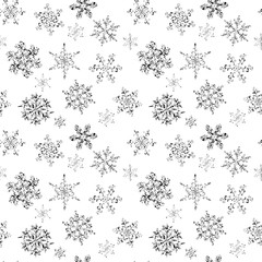 Seamless pattern of hand-drawn black-and-white snowflake 