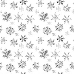 Seamless pattern of hand-drawn black-and-white snowflake 