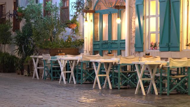 Empty fish restaurant or cafe night in street