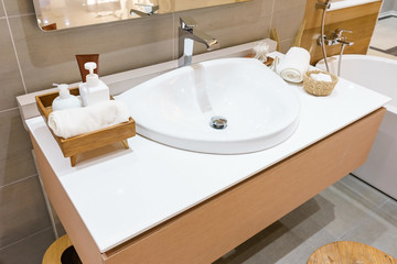 Interior of bathroom with sink basin faucet and mirror. Modern design of bathroom