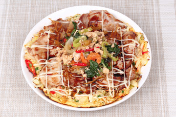 Homemade Japan pizza topped fried spicy basil with minced pork.