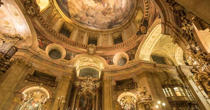 VIENNA, AUSTRIA &ndash; DECEMBER 2015 : Timelapse of St Peter's Church interior with paintings and people in view