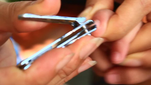 girl trimming nail 