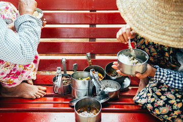 BAGAN, MYANMAR - March 6, 2017: local people eating traditional myanmari food. local people in...