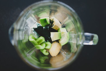 glass of a blender top view, smoothie ingredients, selective focus
