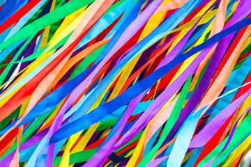 long multicolored ribbons is fluttering in the wind. festive colorful background.