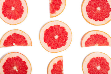 Grapefruit slices isolated on white background. Top view. Flat lay pattern