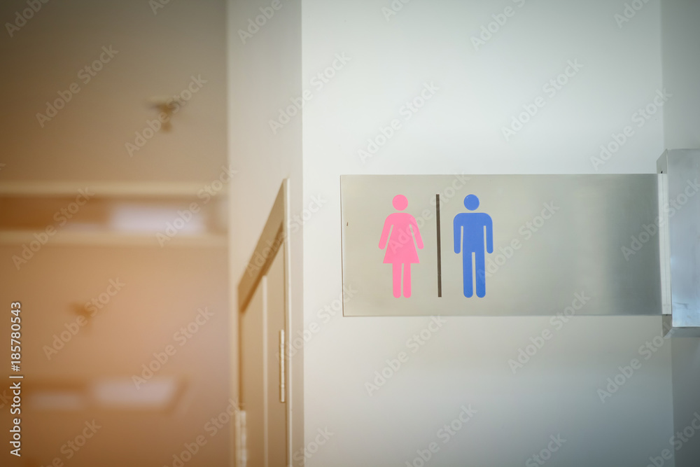 Wall mural bathroom sign men and women on the wall