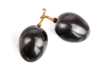 Dark grapes isolated on white background, top view. Flat lay