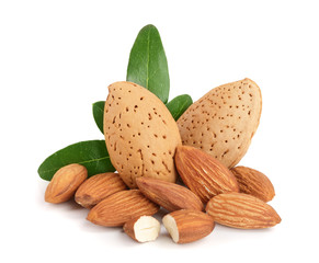 Group of almond nuts with leaves isolated on white background
