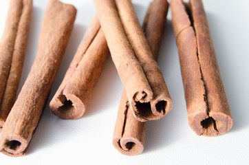 Cinnamon sticks on white background