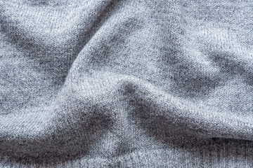 Obraz na płótnie Canvas knitted grey fabric background
