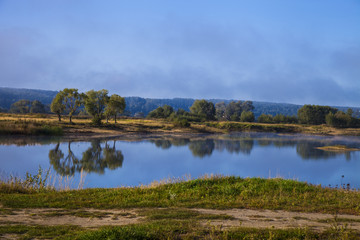 Lake early in the morning with a fog.