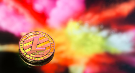 litecoin is a new concept of virtual money on a colorful background, a coin with the image of the...
