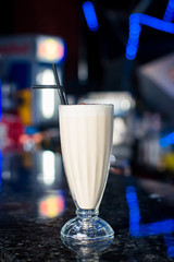 Three glasses of various milkshakes (chocolate, strawberry and vanilla) isolated on white background