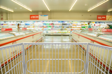 Shopping Trolley Cart with in Hypermarket or Supermarket at Dairy Product Section