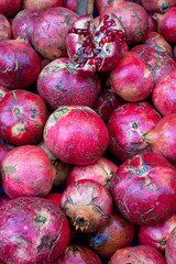 Red cracked pomegranate, background, texture