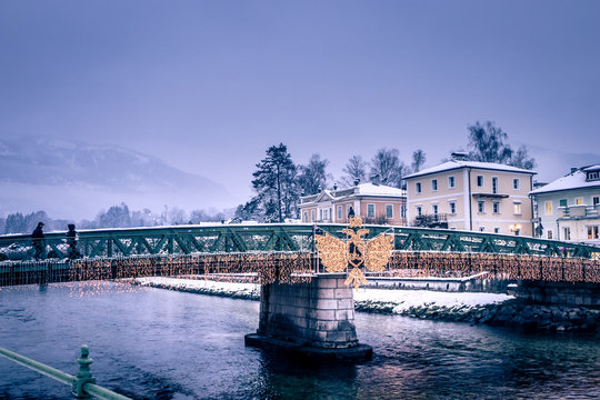 Warm Lights And Christmas Decoration On The Streets On A Cold, Snowy Winter Evening In Spa Resort Bad Ischl In Upper Austria