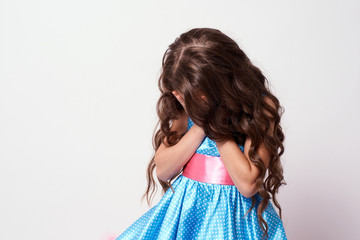 Girl in blue dress. White background