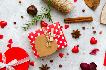 Red gift box with tag and decorations