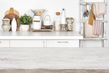 Naklejka na ściany i meble Empty wooden texture table with blurred image of kitchen interior