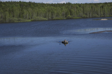 Obraz na płótnie Canvas fishermen catch fish with a rubber boat