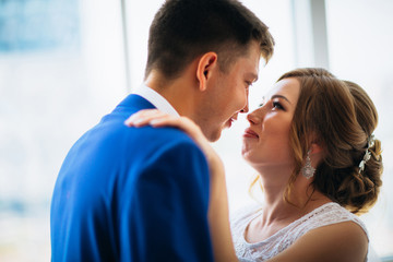 Fototapeta premium bride and groom on background clear windows