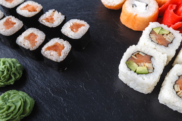 Sushi set on black table background