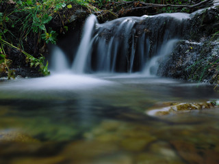 Fototapeta premium Waterfall at the carpatian mountains green forest