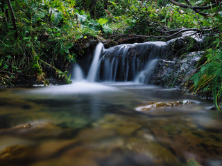 Fototapeta premium Waterfall at the carpatian mountains green forest