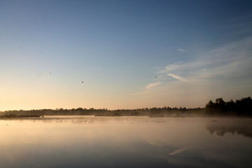 Obraz na płótnie Canvas Sunrise at lake