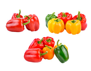 colored peppers over white background