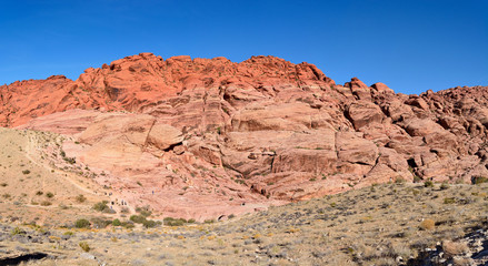 Fototapeta na wymiar Red-rock escarpment of Red Rock Canyon rising in Nevada, USA.