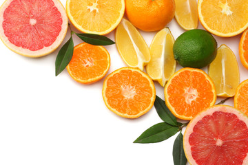 healthy food. mix sliced lemon, green lime, orange, mandarin and grapefruit with green leaf isolated on white background. top view with copy space