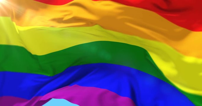 The rainbow flag, LGBT pride flag or gay pride flag waving, loop