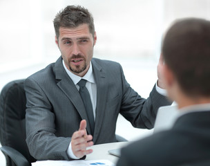 closeup.Manager and client discussing the terms of the contract in the office.