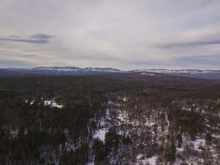 winter forest among the mountains in the middle zone of Russia