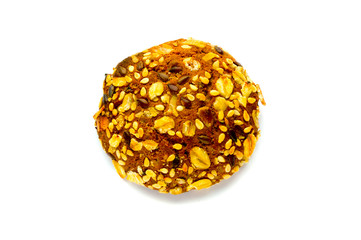 Cookies covered by nuts and raisins isolated on white background